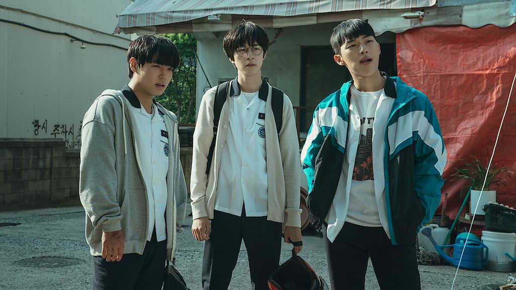 Park Ji-hoon, Choi Hyun-wook, and Hong Kyung standing together in school uniforms in a scene from Weak Hero Class 1